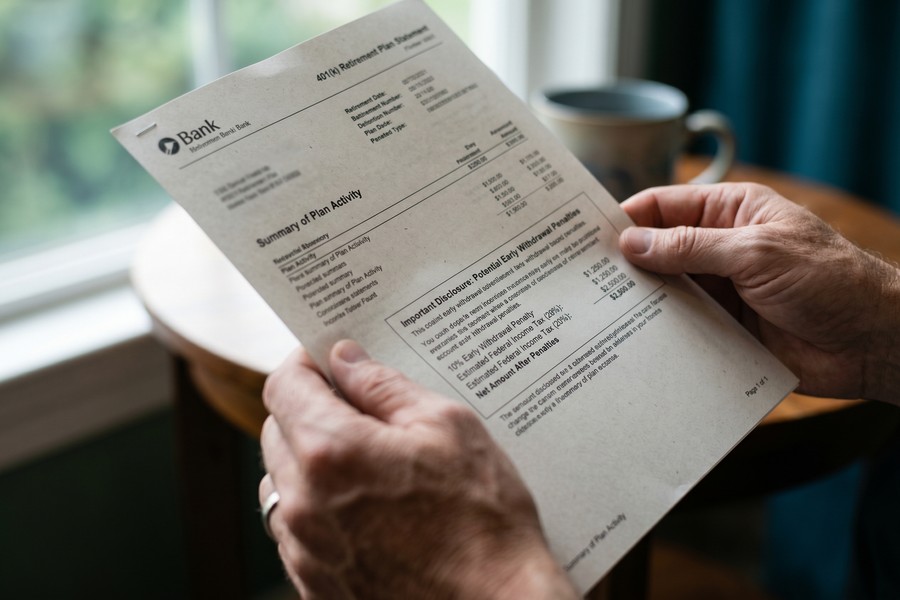 Split comparison showing 401k cash-out net proceeds versus IRA rollover full balance preservation