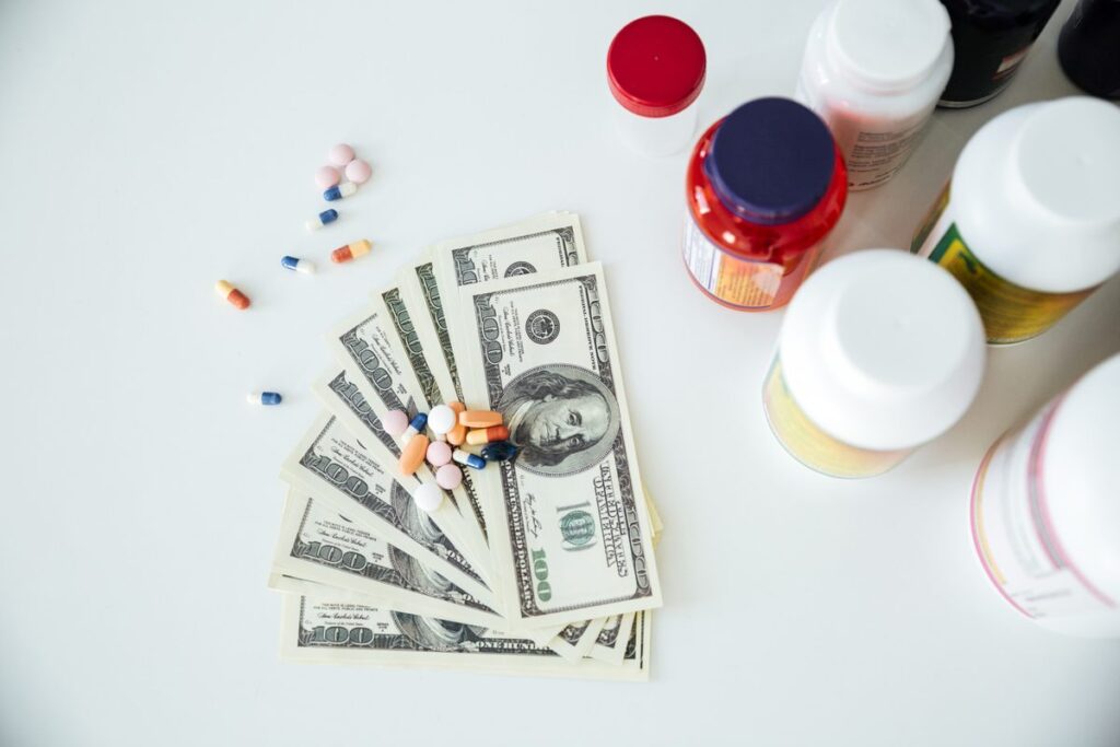 Notebook and calculator showing medical expense tracking for chronic illness budgeting