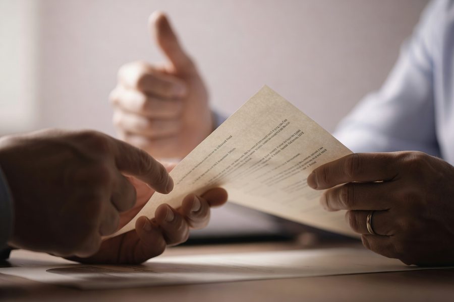 Business owner reviewing exit strategy documents with financial advisor